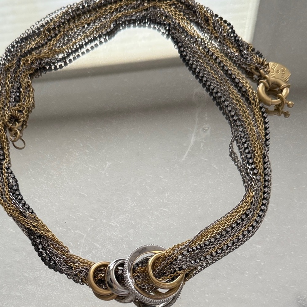 Giles & Bro multi strand silver and gold tone necklace with charms
